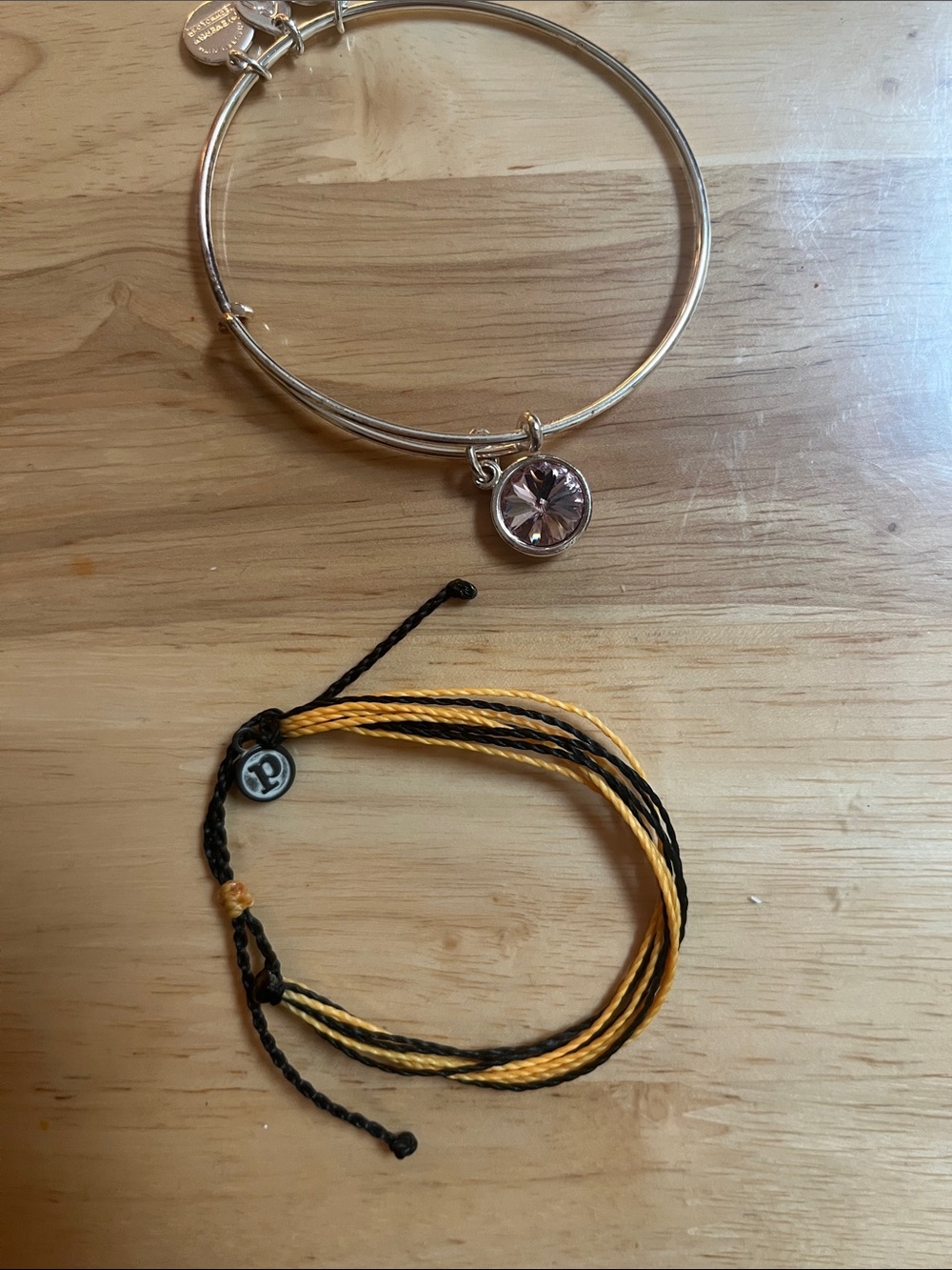 Yellow and black puravida bracelet 

Purple Alex and ani bracelet